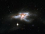Trojice supermasivních černých děr v galaxii NGC 6240